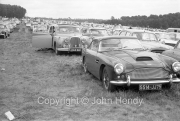 Aston Martin DB4 and our Jaguar in the car park