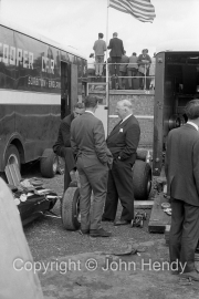 Colin Chapman (back to the camera)