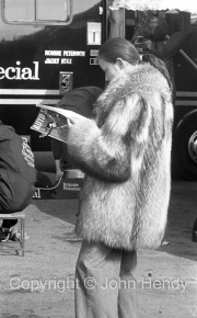Lady in fur coat in the Lotus paddock
