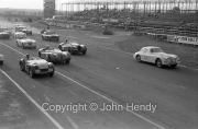 Start - probably the Scratch Race for Popular Sports Cars over 20 Laps. #32 Jaguar XK150 (HT) 3442cc, AJ Lambert. #30 Jaguar XK120 3442cc, J Kenyon. #38 Jaguar XK120 3442cc, RPG Sturgess.