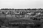 Cars passing a busy pits