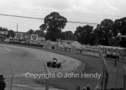 Cars coming round Woodcote corner
