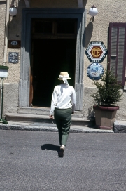 Greta entering the hotel