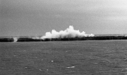 Waves breaking over the harbour wall