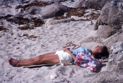 Sarah asleep on the beach
