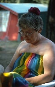 Greta reading, in her rainbow dress