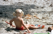 Small blonde girl on the beach