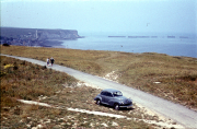 Mulberry Harbour and cliffs at Arromanches, with Bill&apos;s car