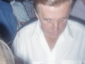 Unknown man signing a cigarette packet