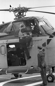 Duke of Edinburgh climbing into the helicopter