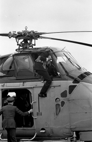 Duke of Edinburgh climbing into the helicopter