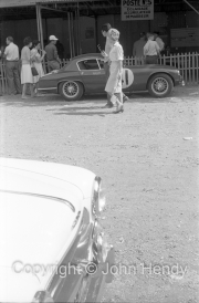 Scrutineering - Girl in front of #41 Lotus Elite (Mk 14)/Coventry Climax (John Wagstaff and Tony Marsh)