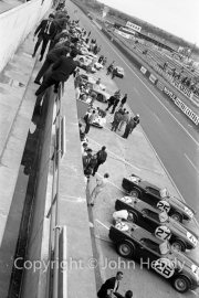View of the pits, with Triumph TR4 S - #25 (Marcel Becquart and Mike Rothschild), #26 (Peter Bolton and Keith Ballisat), #27 (Les Leston and Rob Slotemaker).