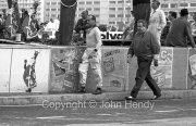 Formula 1 - Retired driver returning to the pits. Not sure who.