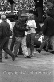 Spectators (?) at the pits after the race
