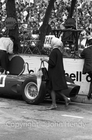 Young lady with umbrella in the pits after the race