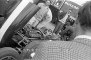 Formula 1 - #1 Cooper T53 Climax FPF (Jack Brabham) in the paddock, with Jack Brabham in the background