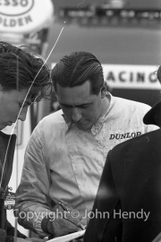 Jack Brabham signing an autograph