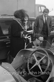 Vintage car and onlookers