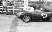 #38 D-Type Jaguar entering paddock. 3442cc RRW21 (Mike Head)