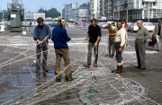 Fishermen mending their nets