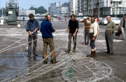 Fishermen mending their nets