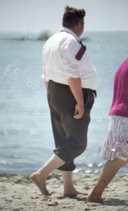 Fat Frenchman on the beach in shirt and tie