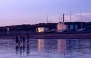 Beach and huts in the evening light