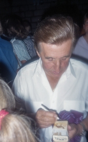 Unknown man signing a cigarette packet