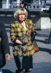 Lady carrying Yorkshire Terrier