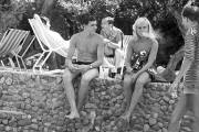 Couple sat on a wall