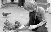 Simon feeding pigeons in algar Square